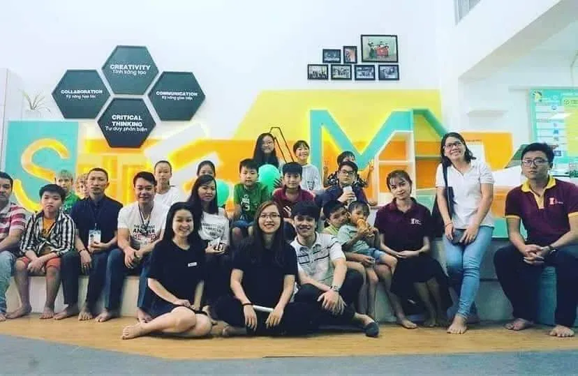 Group photo of the team sitting together at an event.