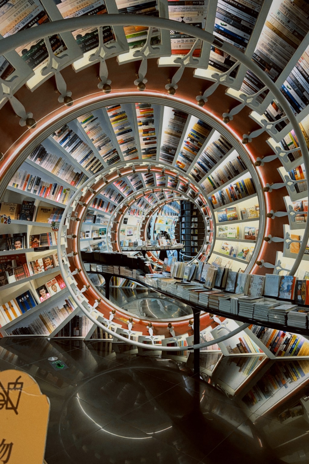 Bookstore in Shenzhen with a spiral staircase and shelves rising overhead